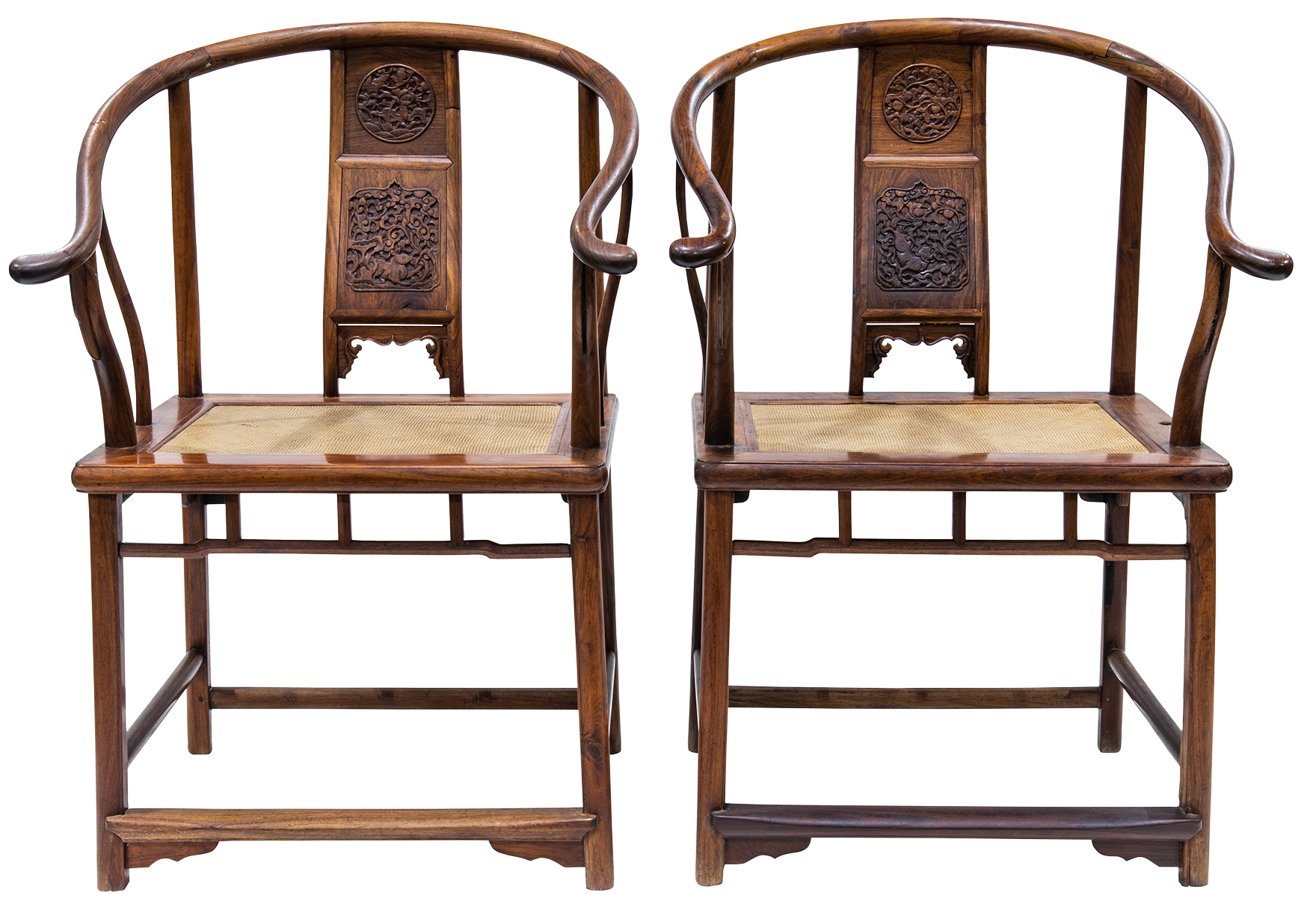Pair of Chinese huanghuali horseshoe-back armchairs.Sold: $200,000
