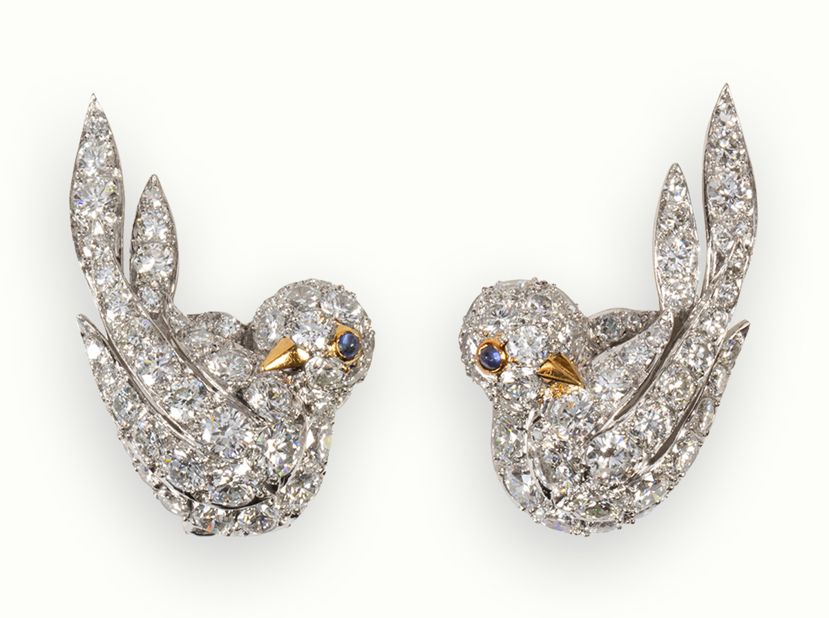 A pair of diamond and platinum earrings, Van Cleef & Arpels.Sold: $49,200