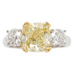 A 4.18 carats fancy light yellow and platinum diamond ring.