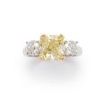 A 4.18 carats fancy light yellow and platinum diamond ring.