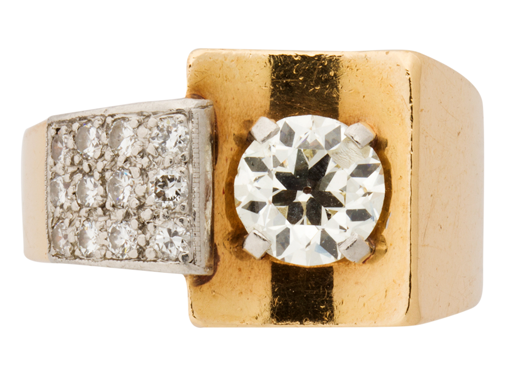A Retro diamond and fourteen karat gold ring.