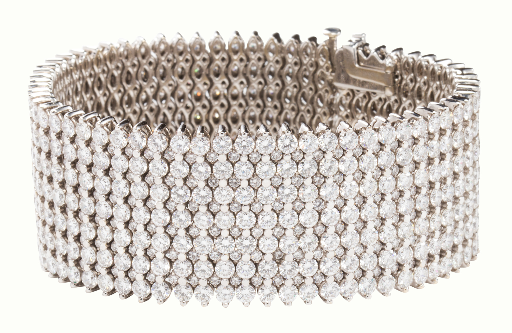 A diamond and eighteen karat white gold strap bracelet.
