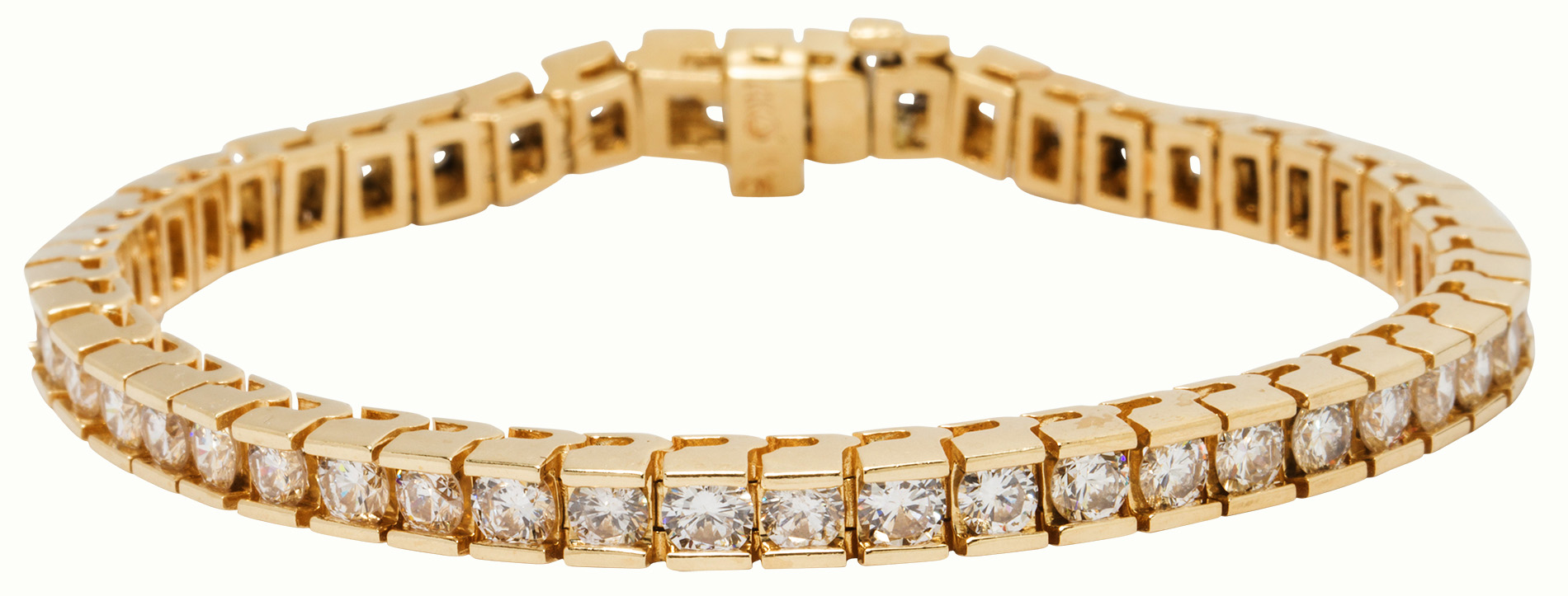A diamond and fourteen karat gold bracelet.