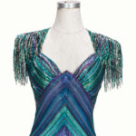 Rita Moreno purple and green mini dress with fringed shoulders, label for Elizabeth Courtney Costumes, Hollywood.