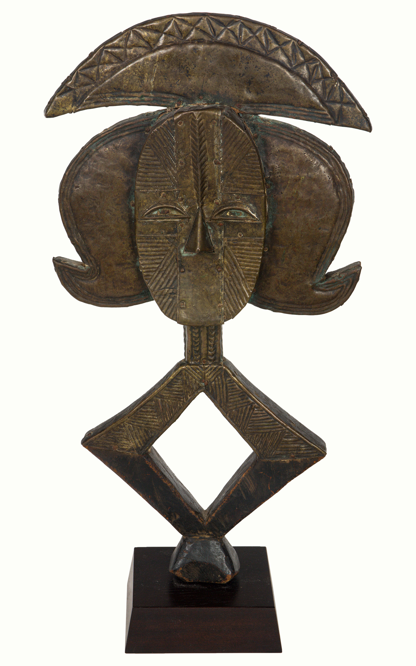 A Bakota reliquary, Gabon, raised on stand, 22.5″h (overall); 20.5″h.