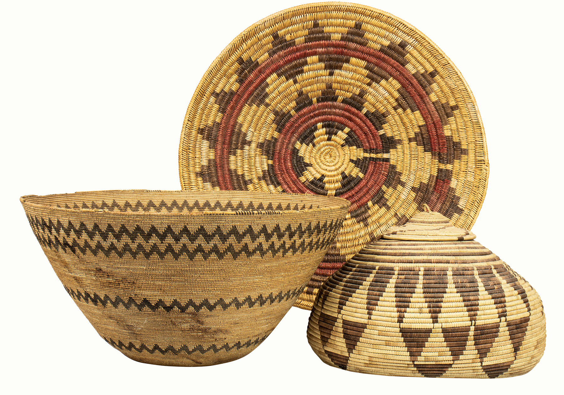 A selection of Native American baskets including a large Pomo gathering basket.