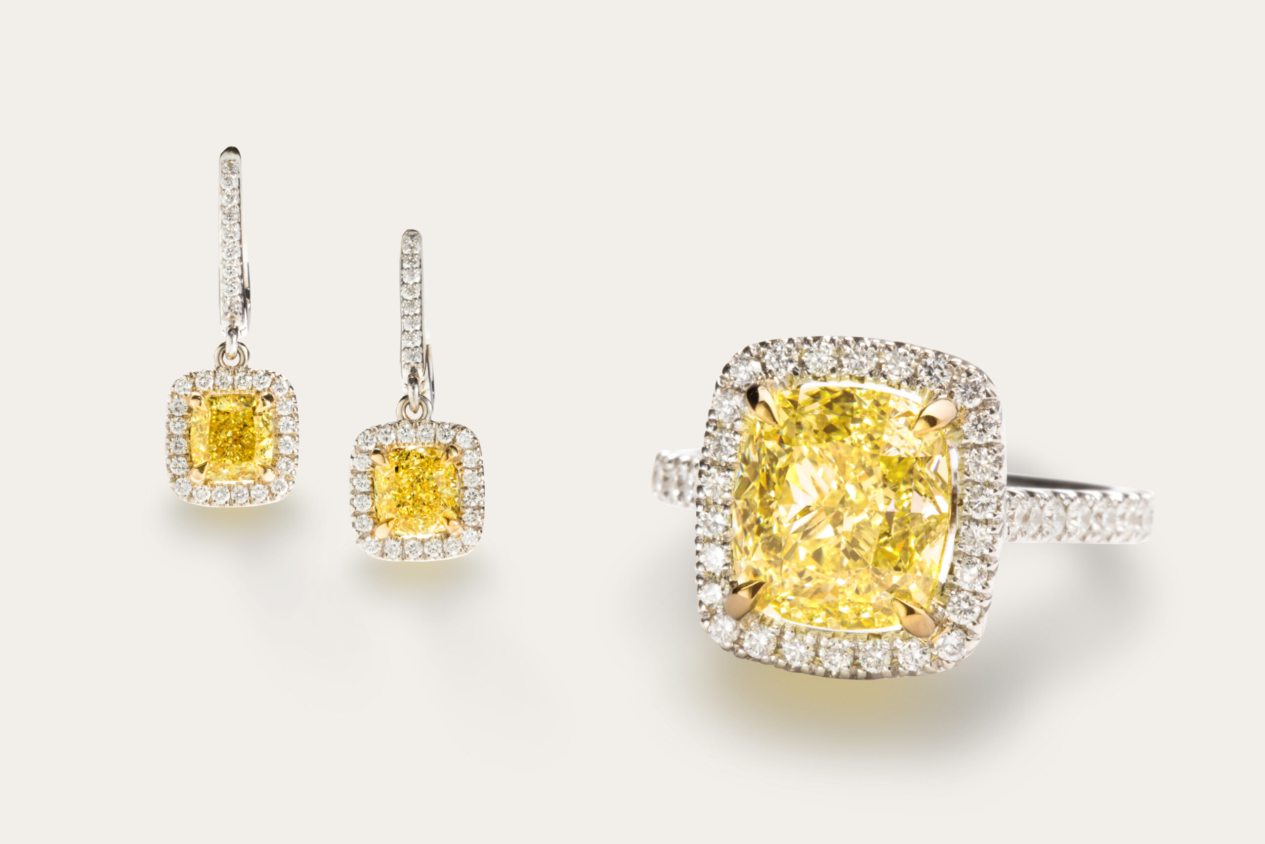 Left: A pair of fancy intense yellow diamond, diamond and 14k white gold earrings. Right: A fancy yellow diamond, diamond and 14k white gold ring.