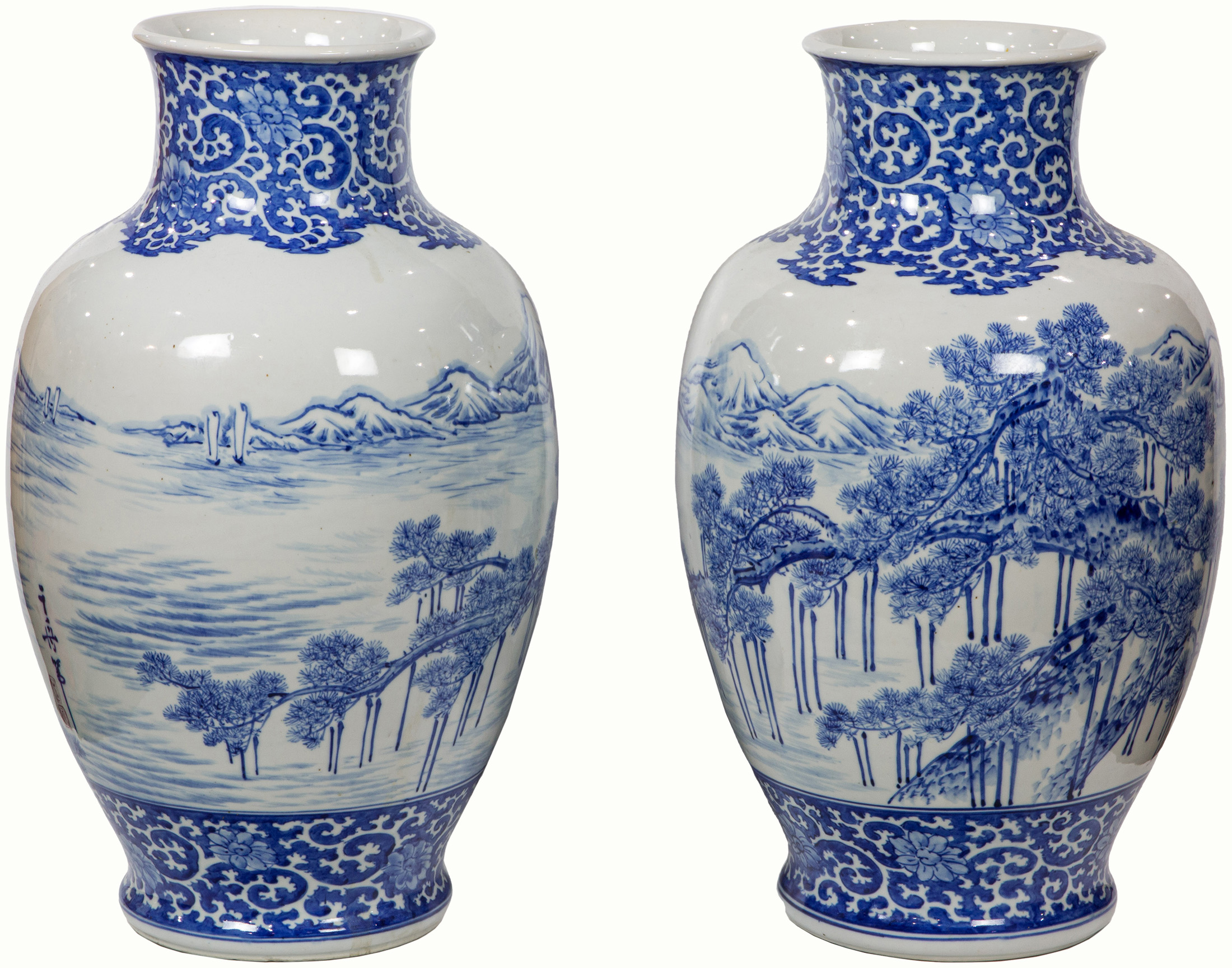 A pair of Asian underglaze blue vases, 23.75″ tall.