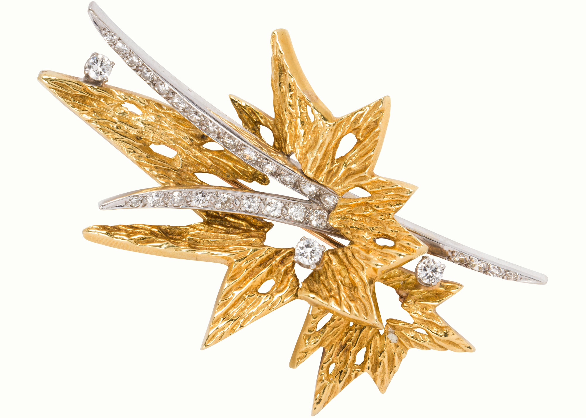 A diamond and 18k bi-color gold brooch-pendant of stylized starburst design.