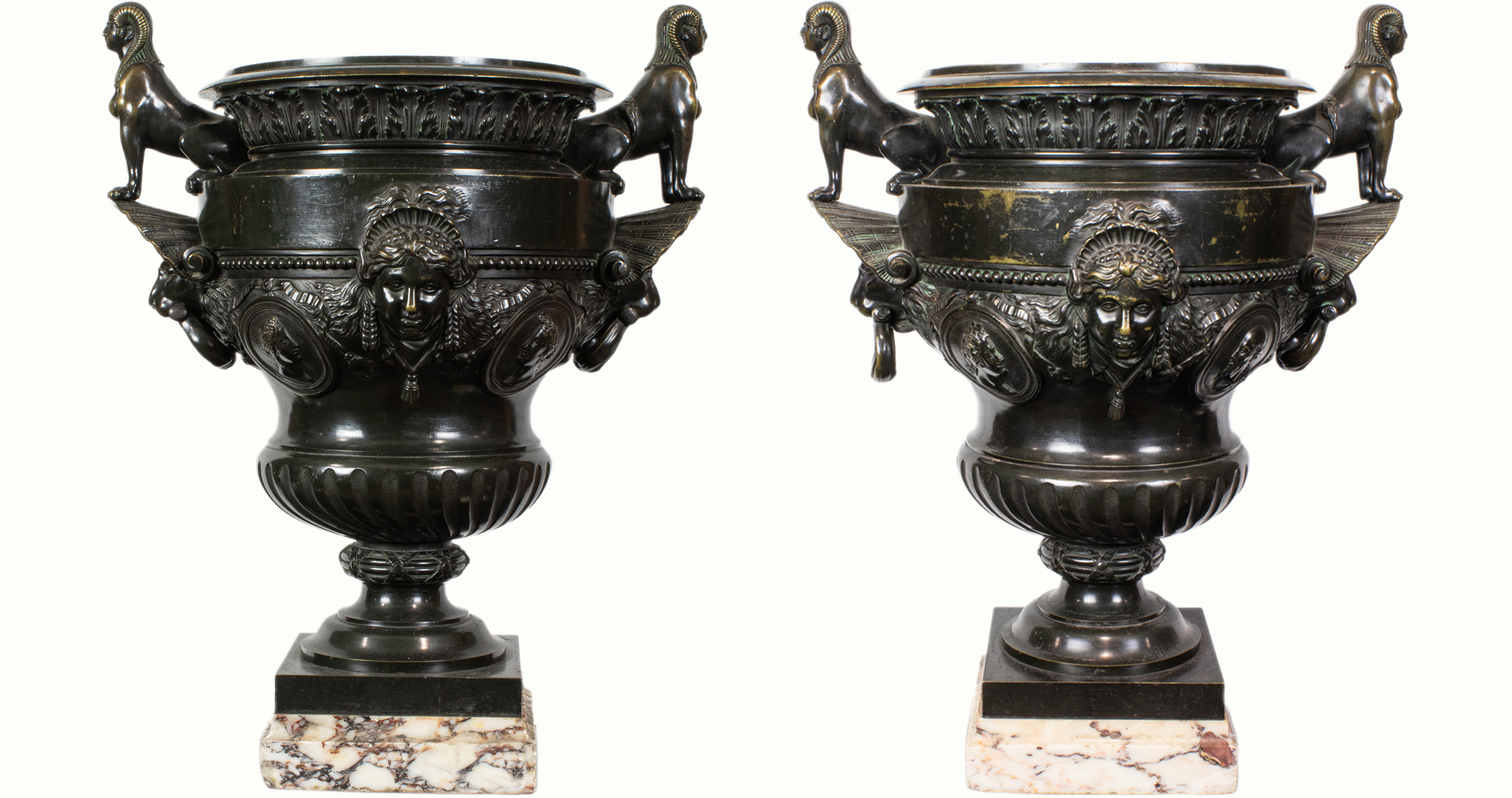 A large pair of Egyptian Revival patinated bronze two-handled urns, 19th century.