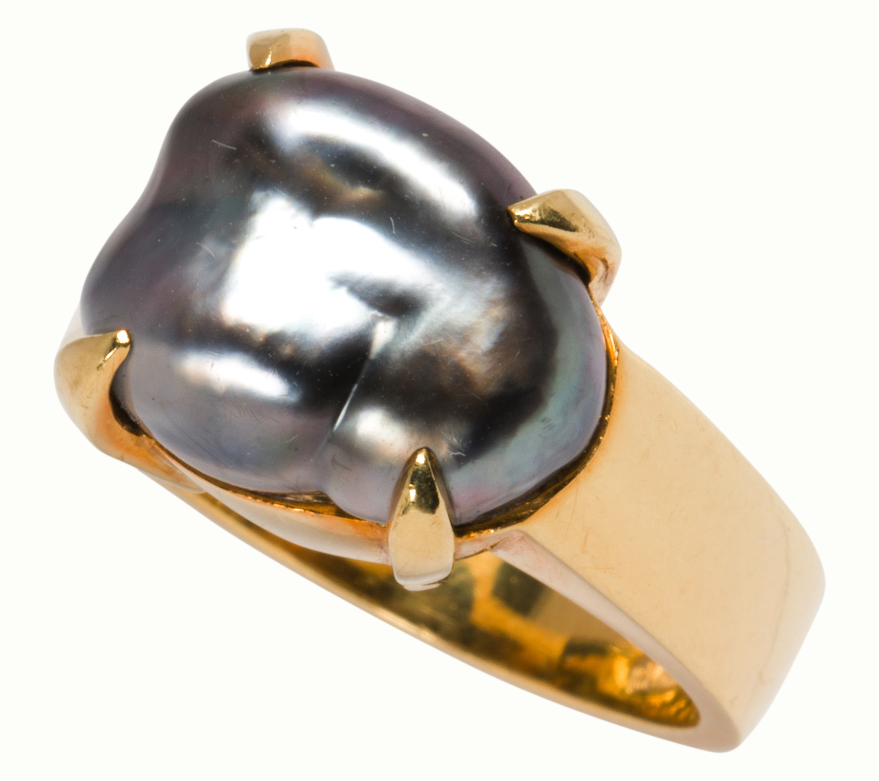 A black cultured baroque pearl and 18k gold ring.