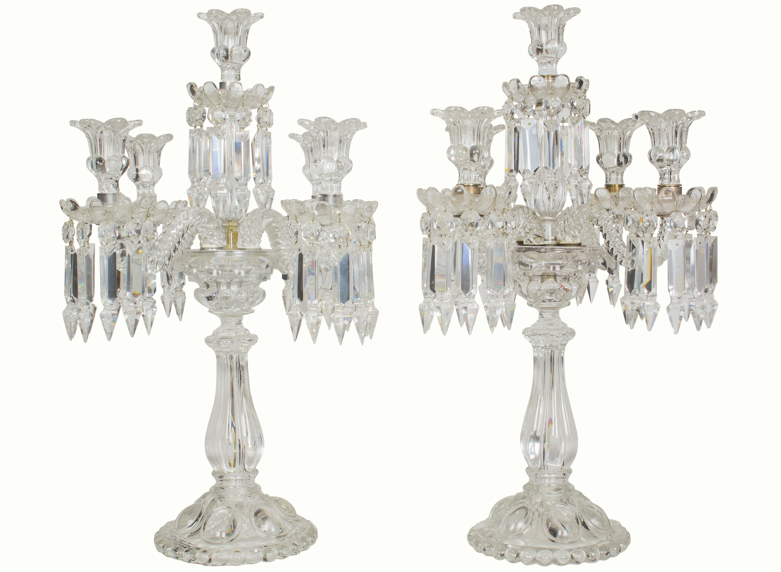 A pair of Baccarat molded and cut glass five light candleabra in the Medallion pattern.