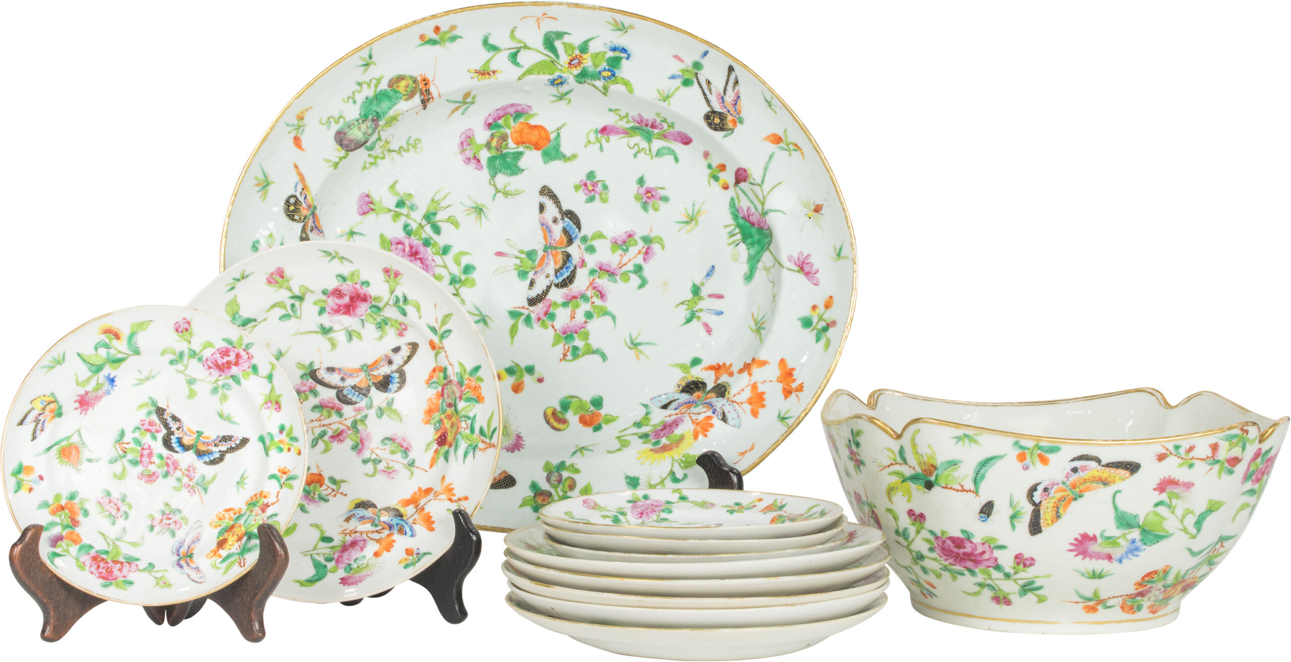 A suite of Chinese Export famille rose porcelain with butterflies and flowers.