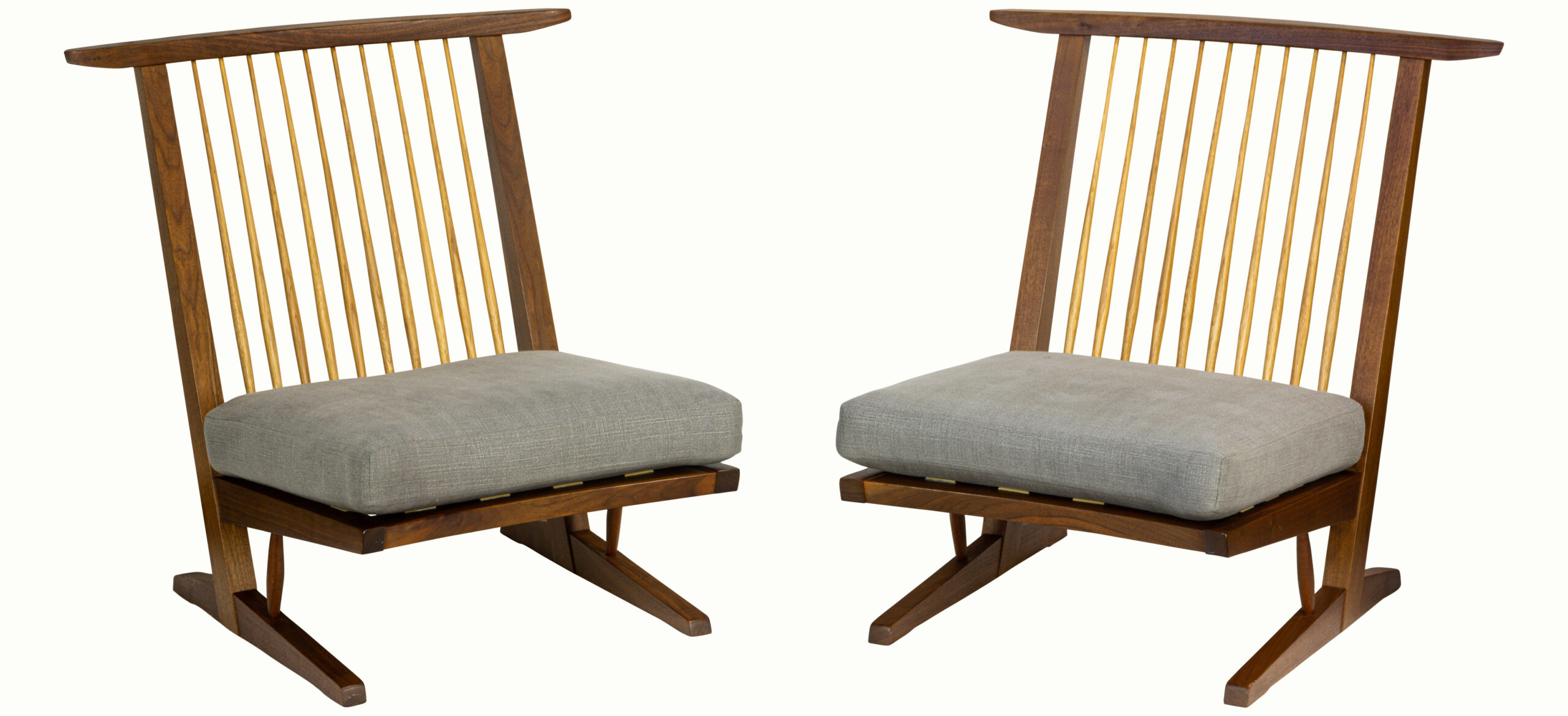 A pair of Mira Nakashima walnut Conold Cushion chairs with a copy of the original order card.