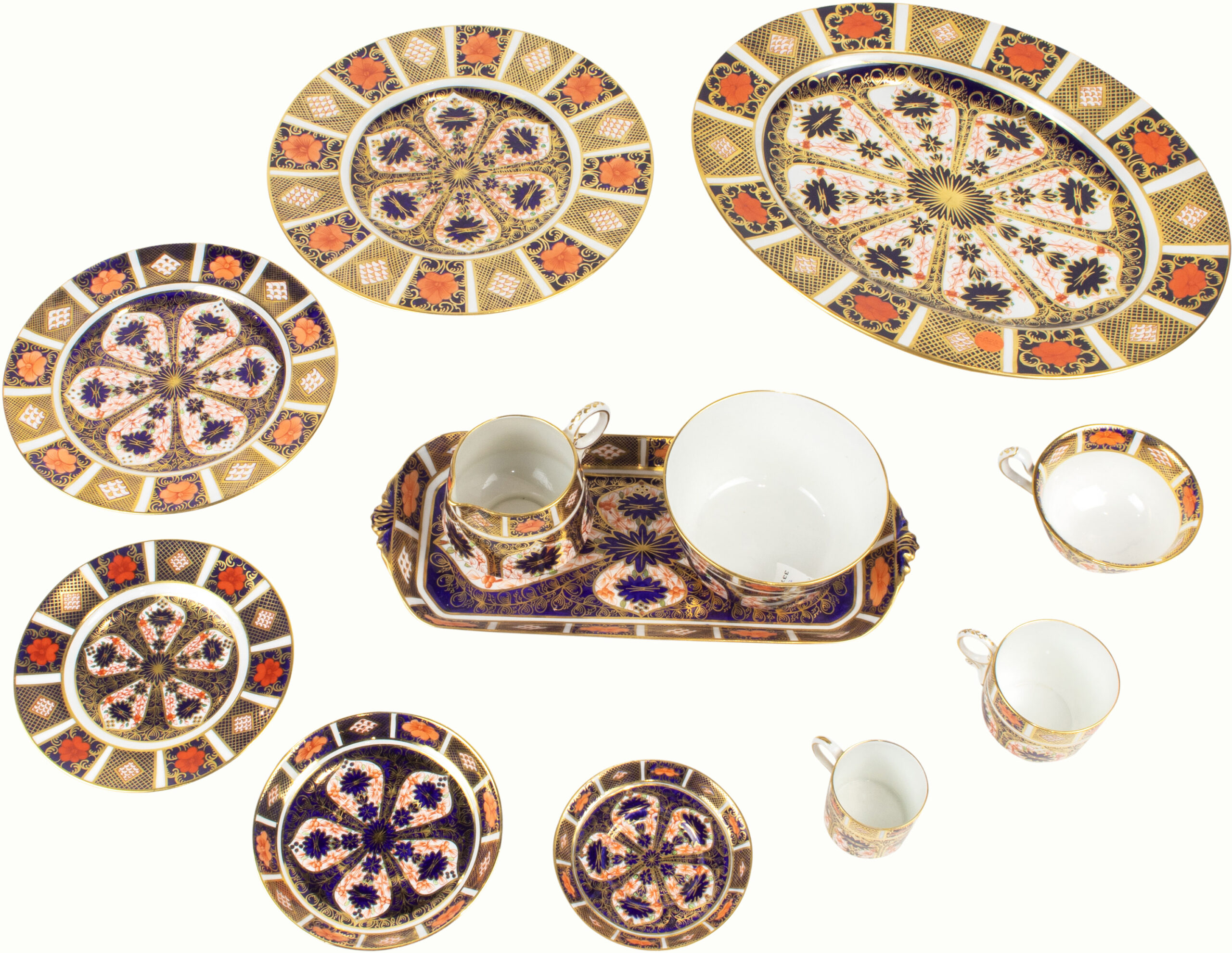 A Royal Crown Derby assembled porcelain dinner service in the Old Imari pattern 1128.