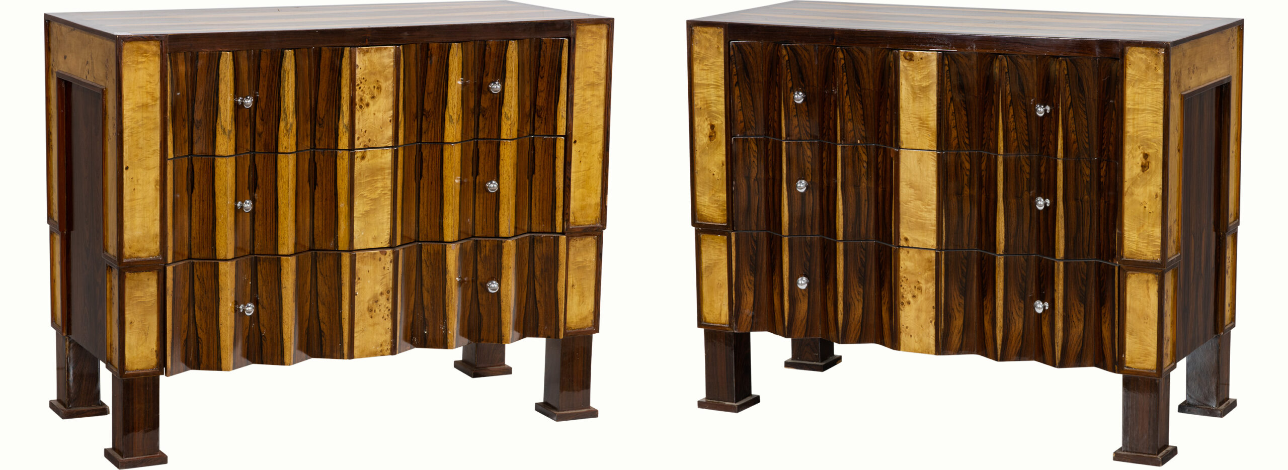 A pair of Art Deco rosewood and mixed wood commodes.Estimate: $1,500–$2,000