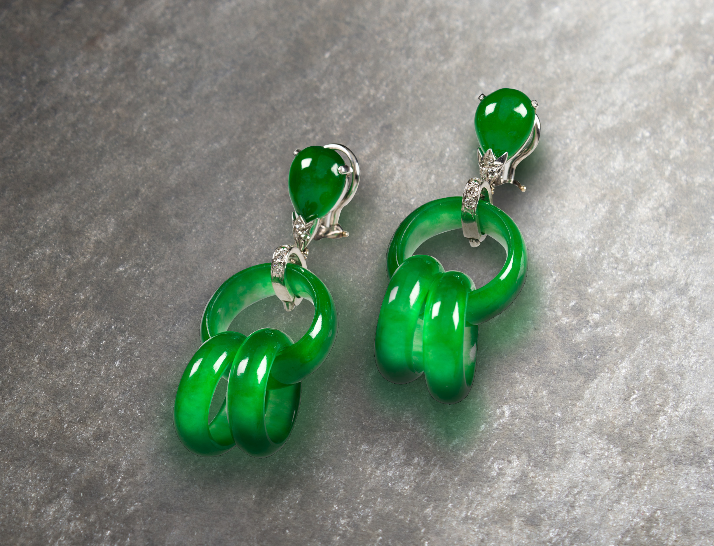 A pair of ‘A Grade’ jadeite and platinum earrings.<br><b>Sold: $88,200</b>