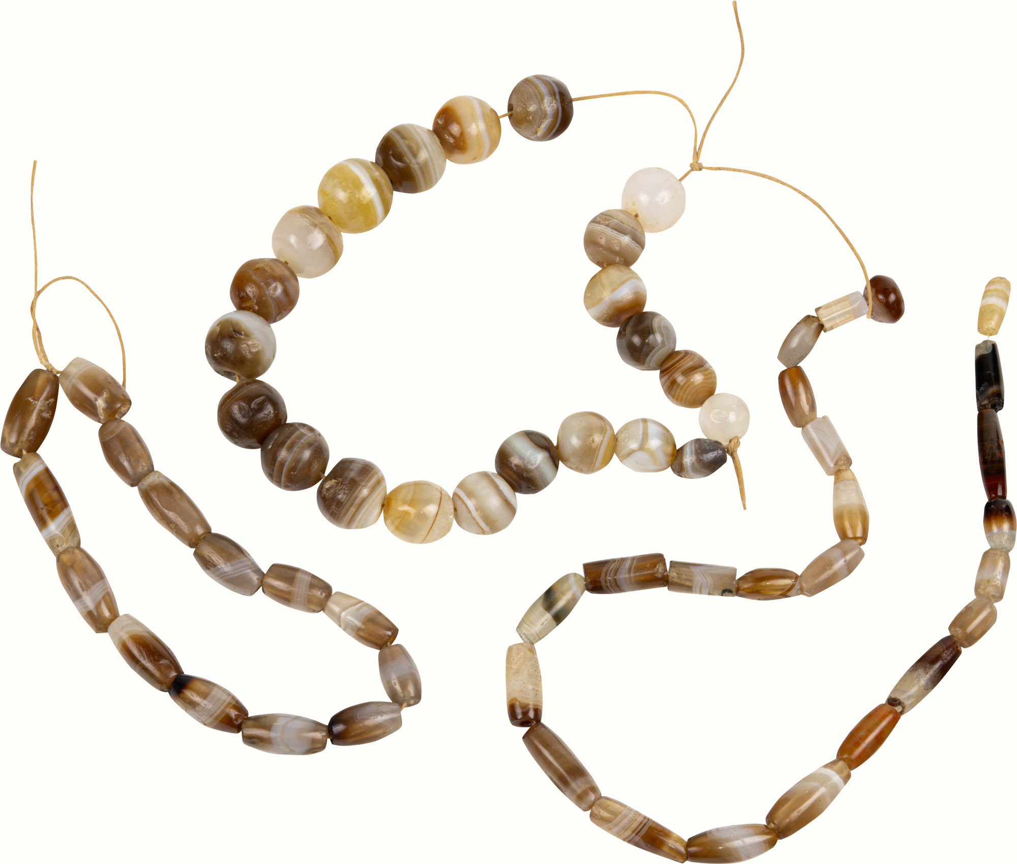 Three strands of ancient Afghani banded agate beads.<br><b>Estimate: $1,000–$1,500</b>