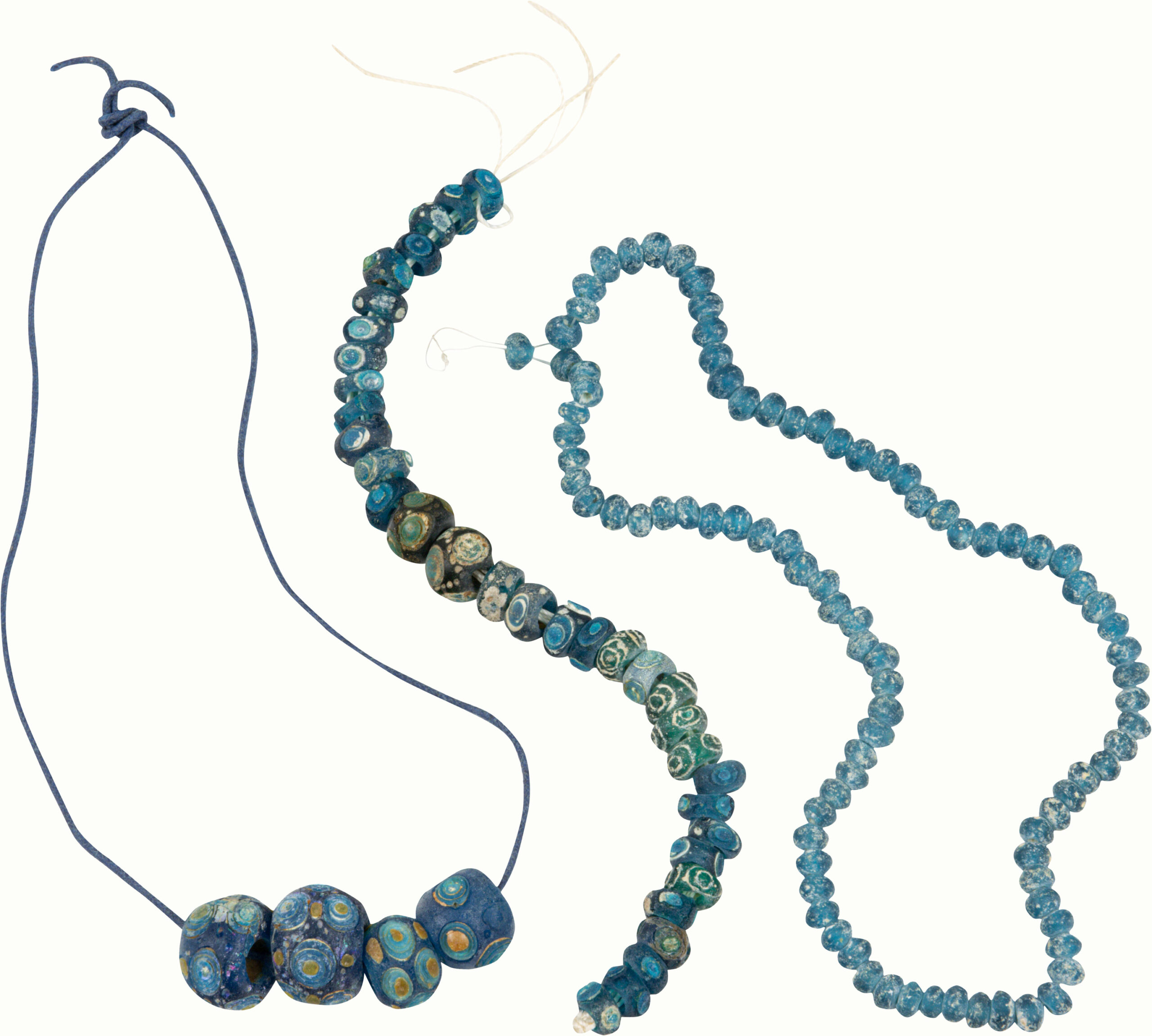 A group of Warring States blue glass ‘eye’ beads.<br><b>Estimate: $1,000–$1,500</b>