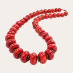 An exceptionally rare Tibetan red coral bead necklace.Estimate: $100,000–$150,000