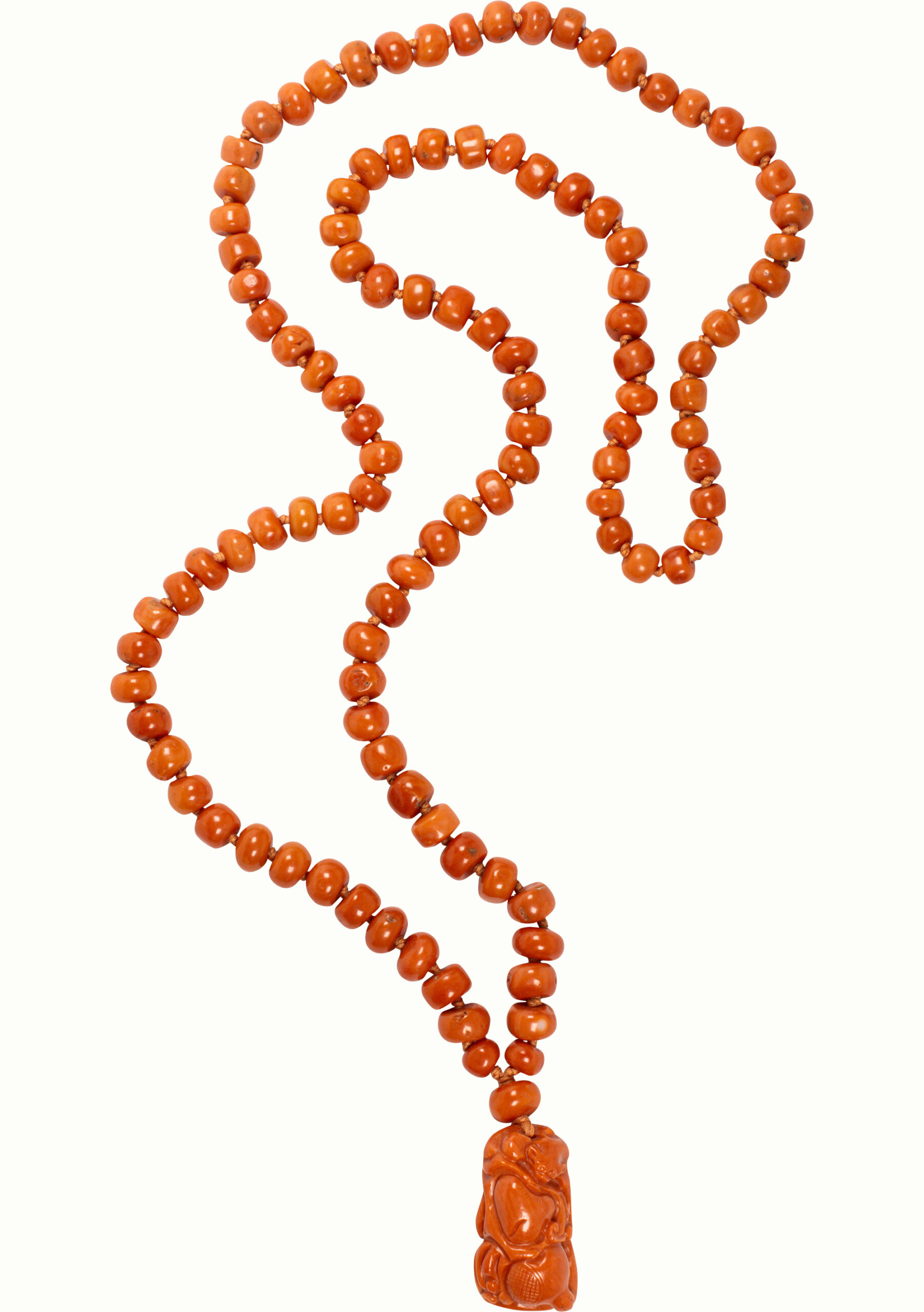 A Sino-Tibetan red coral bead necklace and pendant.<br><b>Estimate: $2,000–$4,000</b>