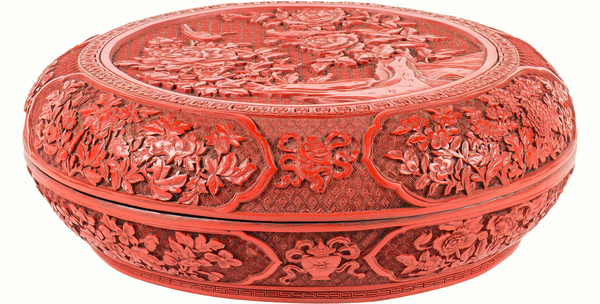 A Chinese carved cinnabar lacquer circular box and cover, Qianlong period.Estimate: $8,000–$12,000