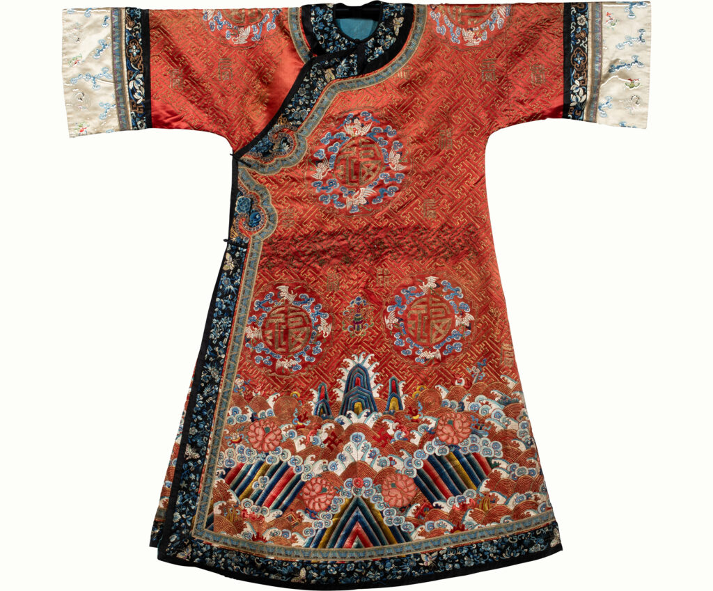 A Chinese embroidered red-ground lady’s robe with longevity symbols. Sold: $7,560