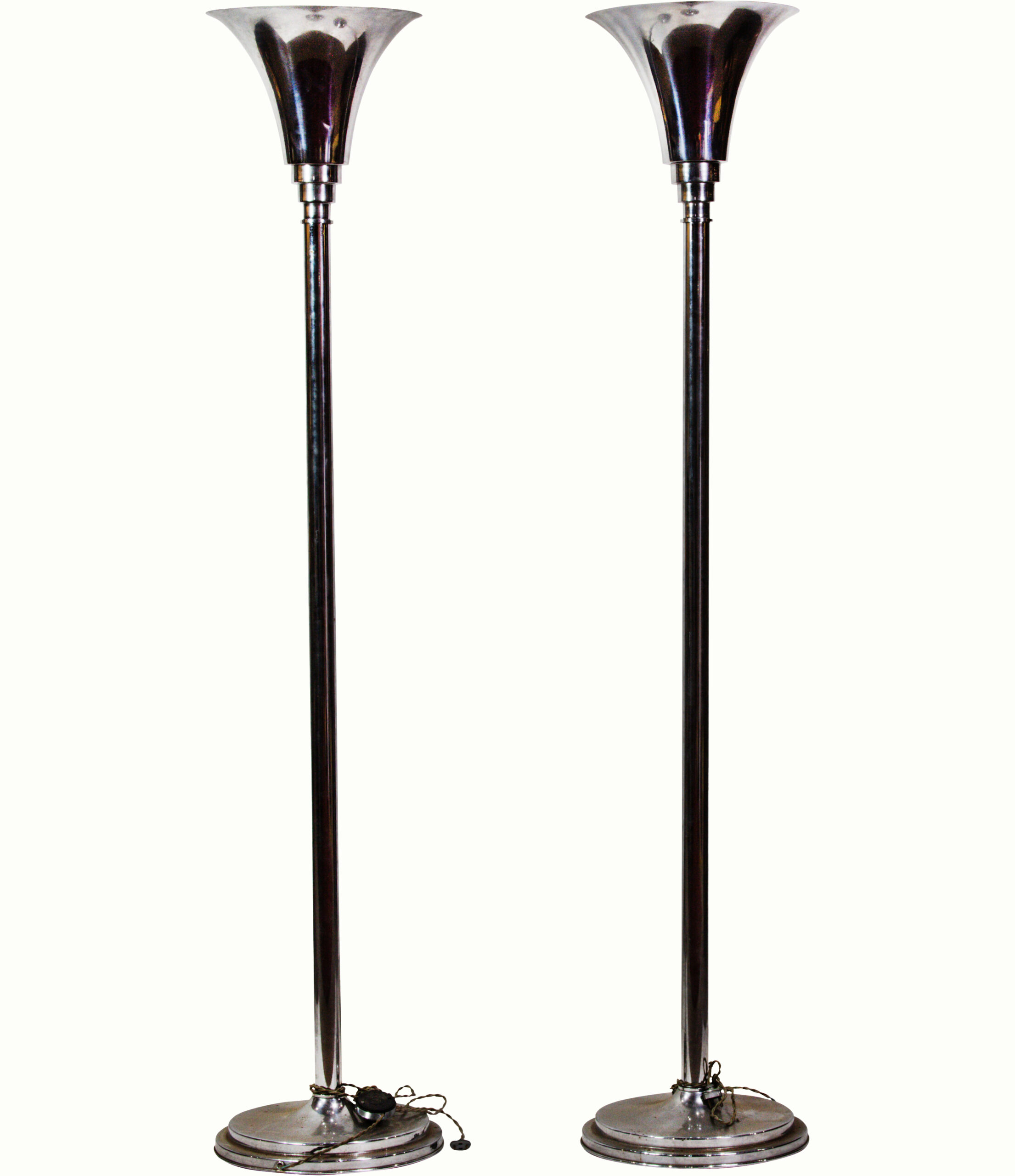 A pair of Robert Mallet-Stevens (1886–1945) chromed metal torchiere floor lamps.<br><b>Estimate: $1,200–$1,800</b>