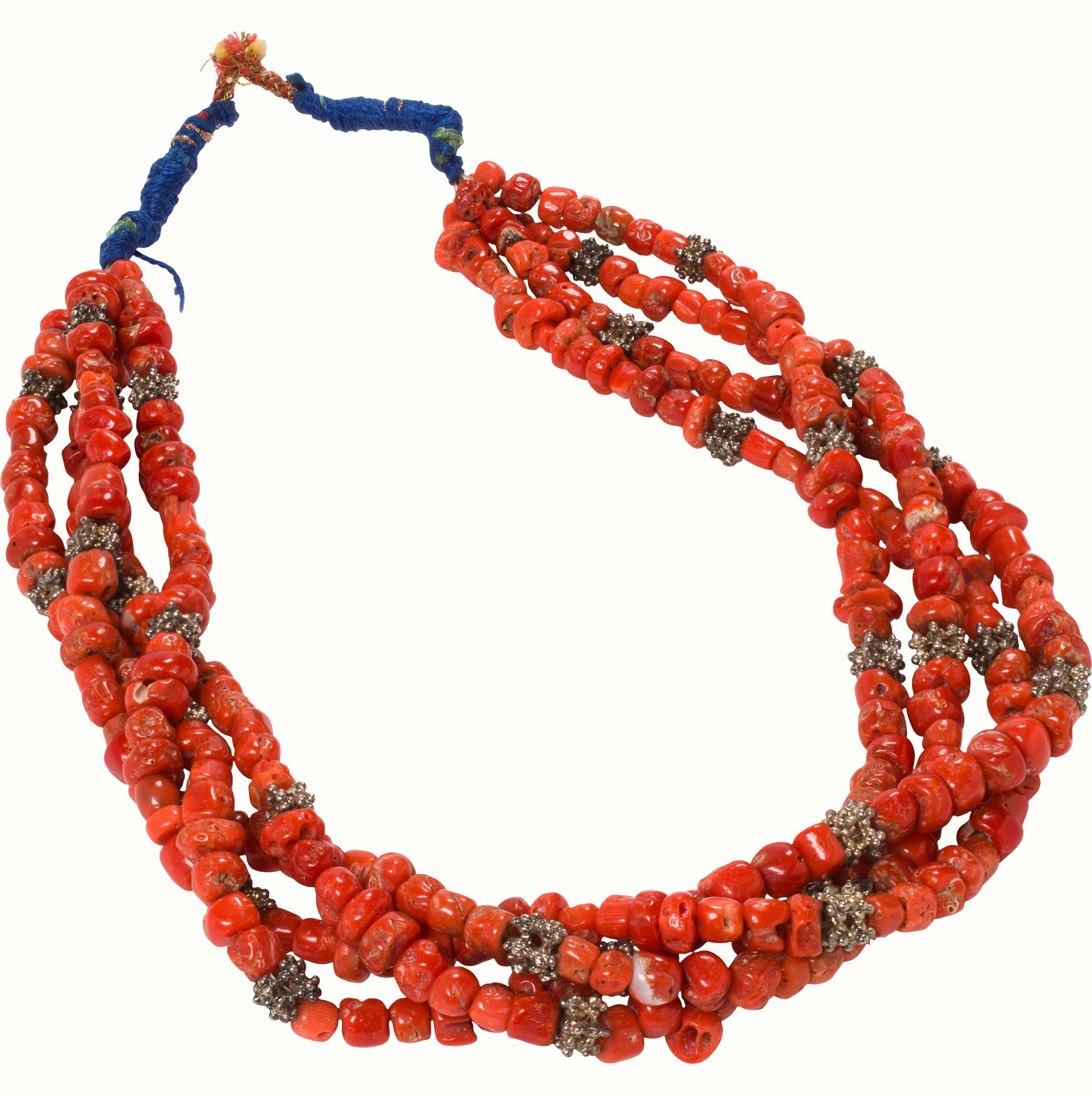 A Tibetan multi-strand red coral and silver beads necklace. Estimate: $1,000–$1,500