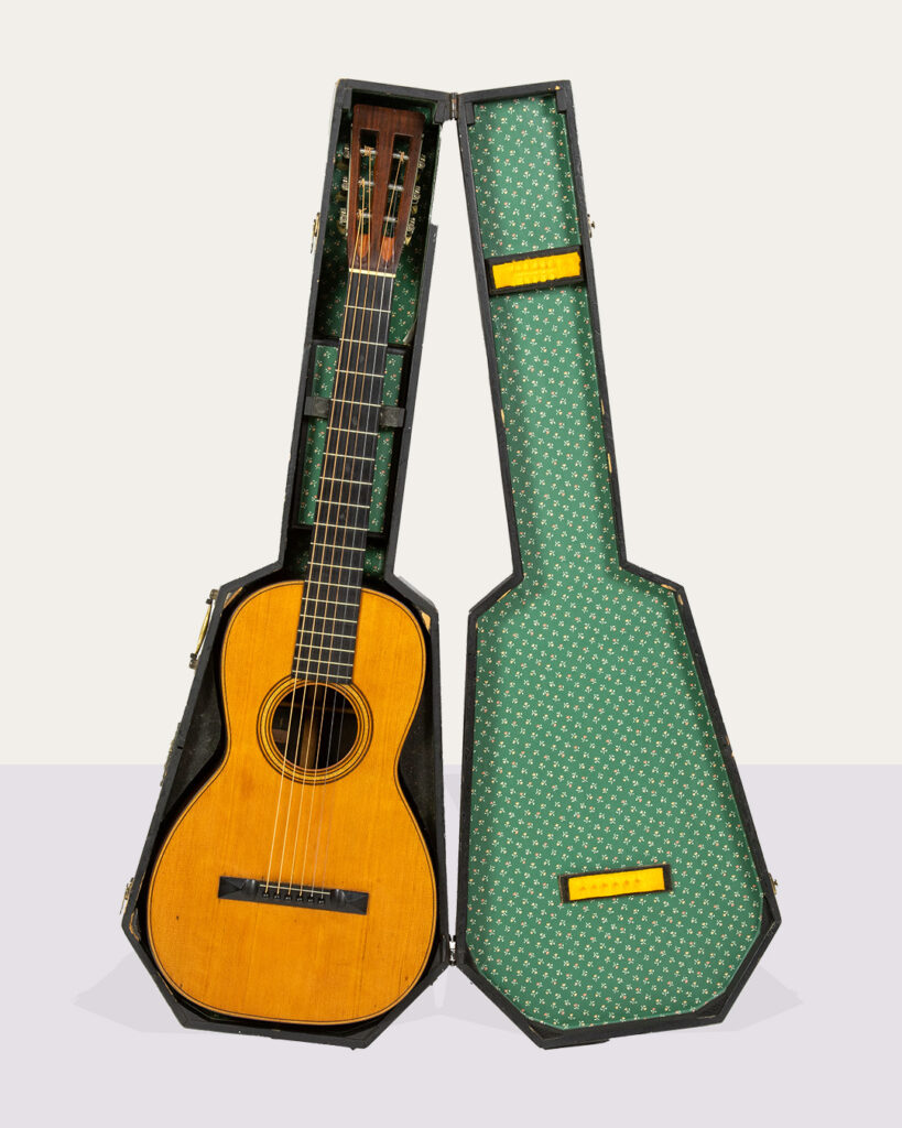 A vintage C. Martin New York Guitar, marked 0452, in an ebonized wood case. Estimate: $8,000–$10,000