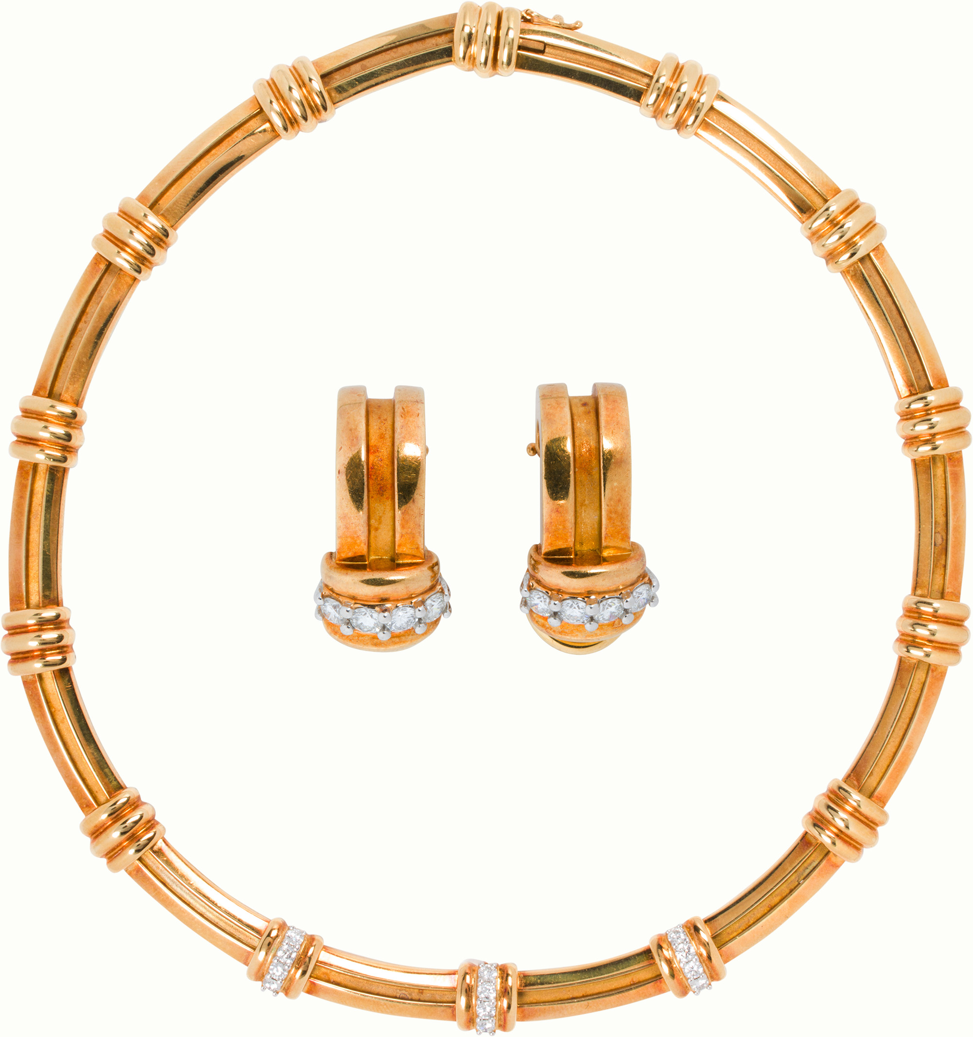 A Tiffany & Co. diamond and 18k gold earrings and necklace set. <br><b>Estimate: $6,000–$8,000</b>