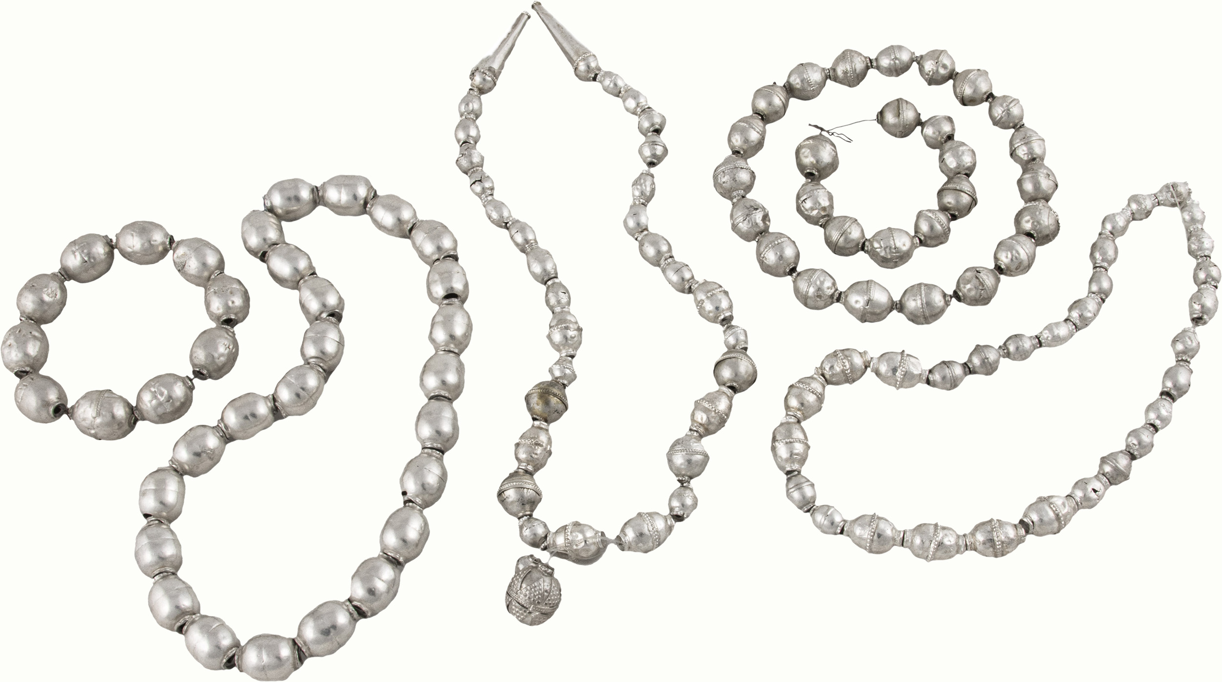 A group of Yemeni silver beads.<br><b>Estimate: $800–$1,200</b>