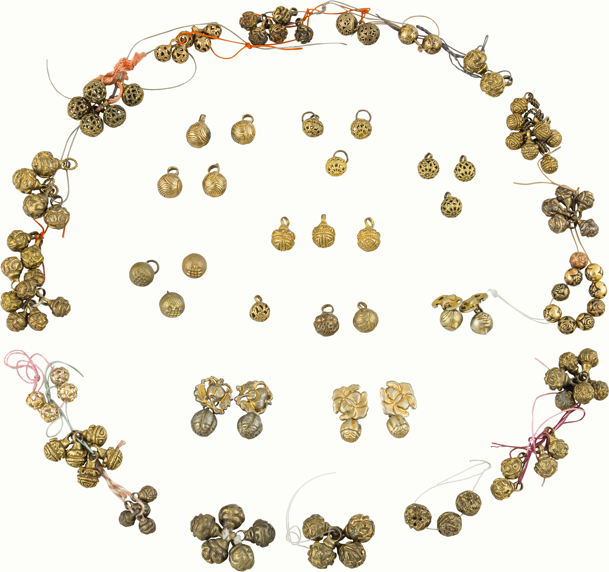 A group of Chinese gilt bronze buttons. <br><b>Estimate: $1,000–$1,500</b>