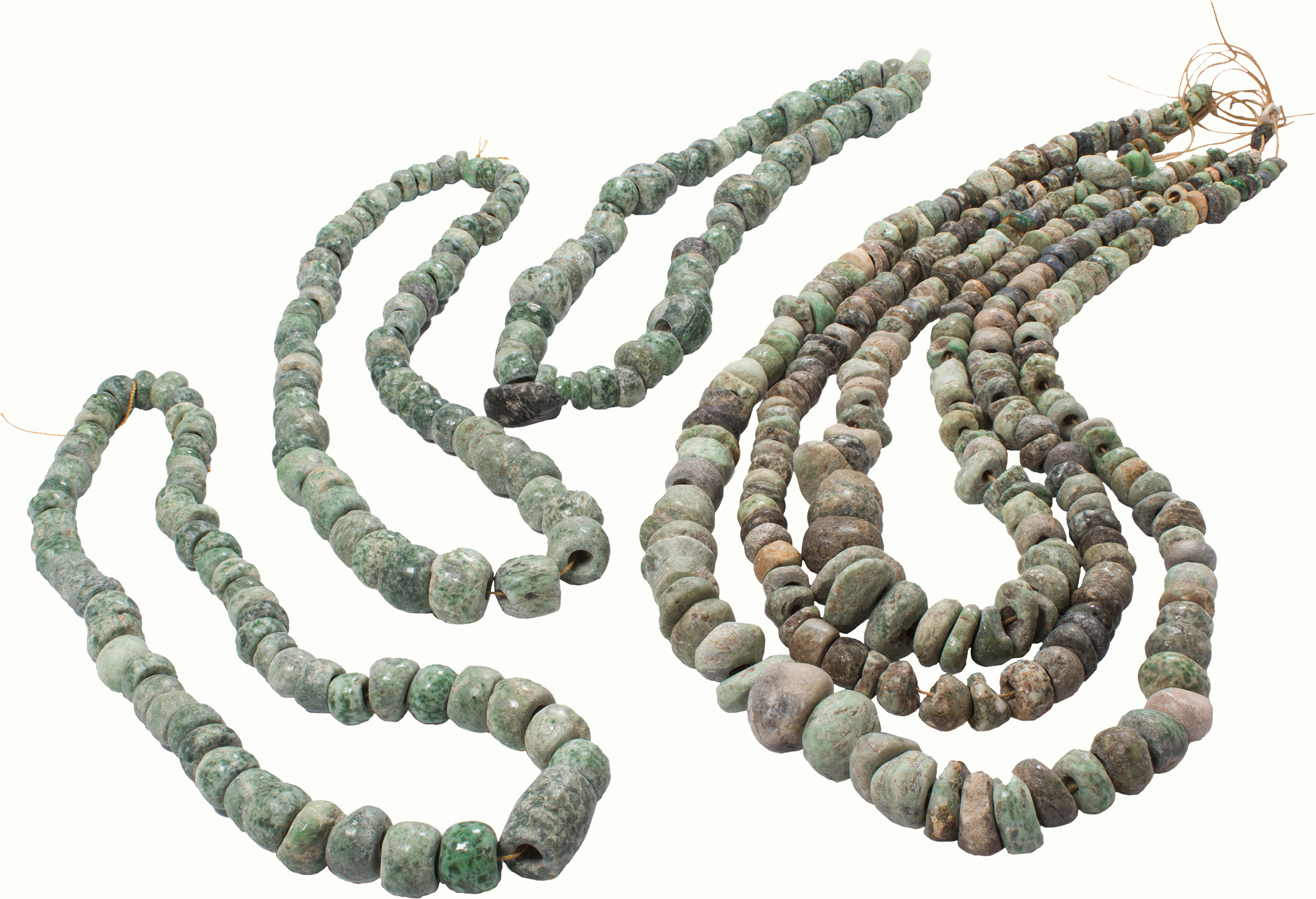 A group of Pre-Columbian green stone beads from Mexico.<br><b>Estimate: $600–$900</b>