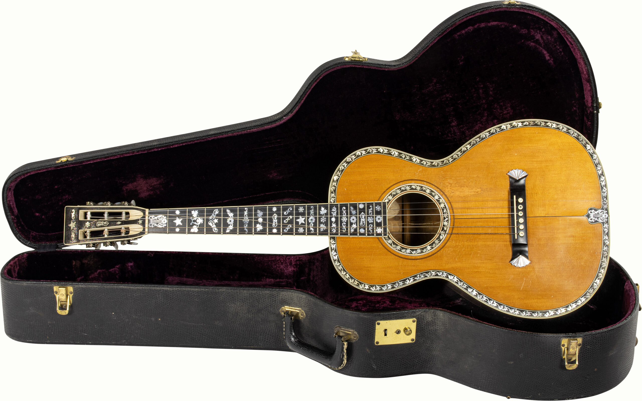 A Washburn Style 309 Grand Concert Presentation Guitar circa 1890, with mother of pearl decoration, sticker ‘Joseph Lennard L Rosenburg Denver’, with hard case. Please note this guitar was offered at Guernseys as lot 49 in their April 2014 auction. <br><b>Estimate: $5,000–$7,000</b><br><em>This property is being sold at public auction as provided by Internal Revenue Code section 6335. Only the right, title, and interest of the Hank Risan is being offered for sale. Property is sold “as is, where is” without recourse against the United States. The United States offers no Guarantee or warranty, implied or expressed on the condition of any property or its fitness for any purpose or use.</em>