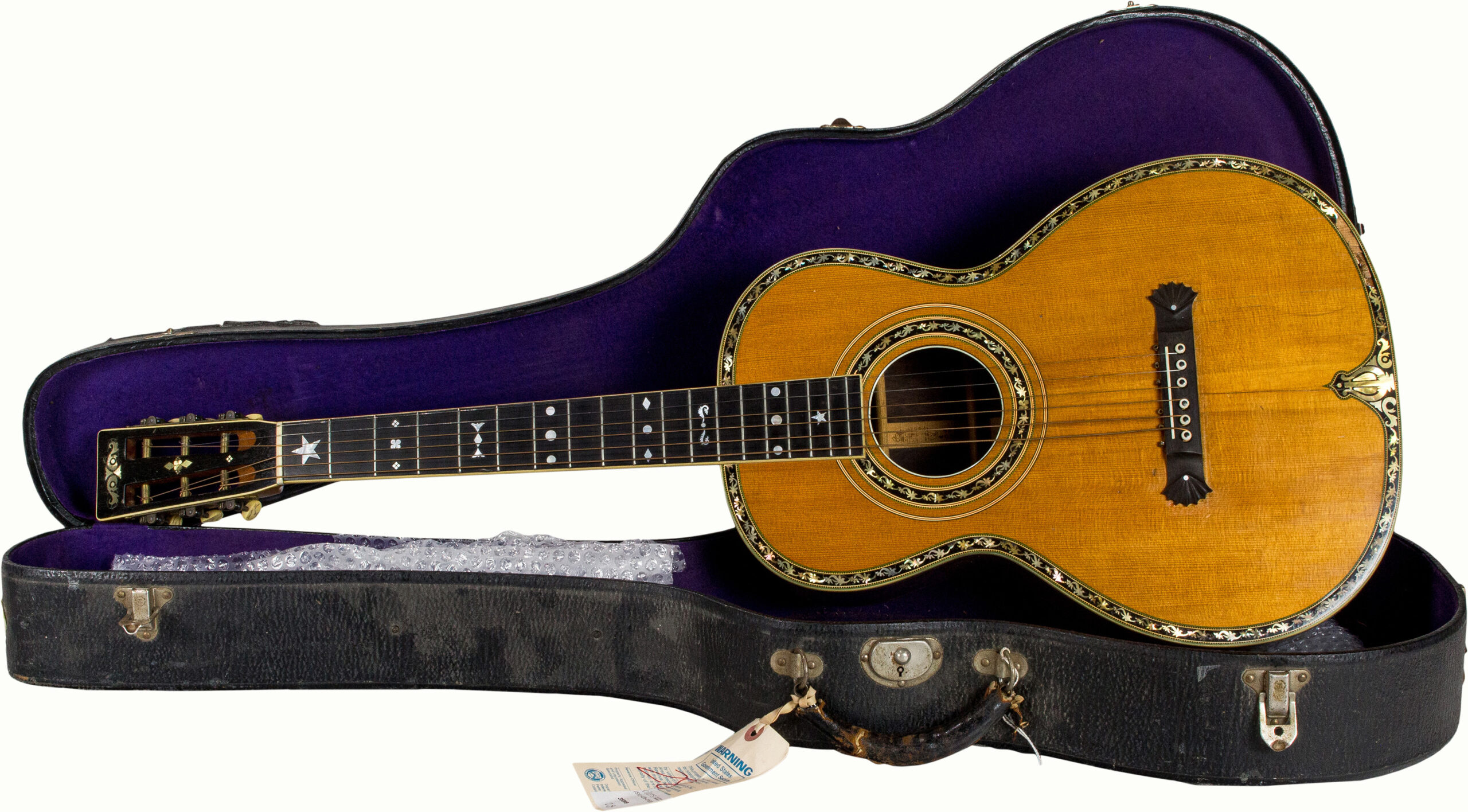 A Washburn Style 308 acoustic guitar, serial number 45803 in cavity, New Model, with hard case.<br><b>Estimate: $8,000–$10,000</b><br><em>This property is being sold at public auction as provided by Internal Revenue Code section 6335. Only the right, title, and interest of the Hank Risan is being offered for sale. Property is sold “as is, where is” without recourse against the United States. The United States offers no Guarantee or warranty, implied or expressed on the condition of any property or its fitness for any purpose or use.</em>