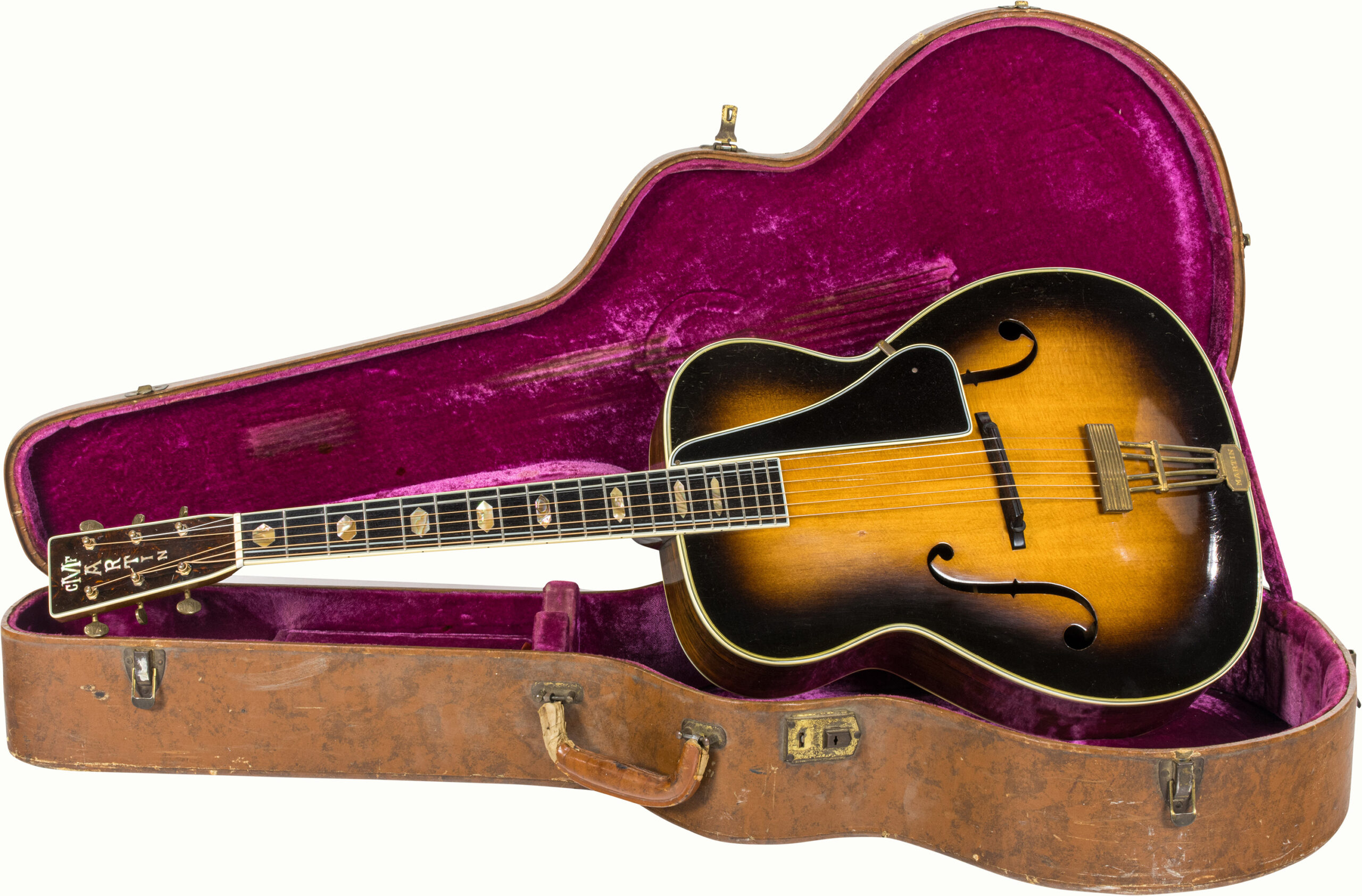 A 1938 Martin F-9 Arch Top acoustic guitar cavity #69376, with brown hard case, one of only 72 examples produced.<br><b>Estimate: $2,000–$4,000</b><br><em>This property is being sold at public auction as provided by Internal Revenue Code section 6335. Only the right, title, and interest of the Hank Risan is being offered for sale. Property is sold “as is, where is” without recourse against the United States. The United States offers no Guarantee or warranty, implied or expressed on the condition of any property or its fitness for any purpose or use.</em>