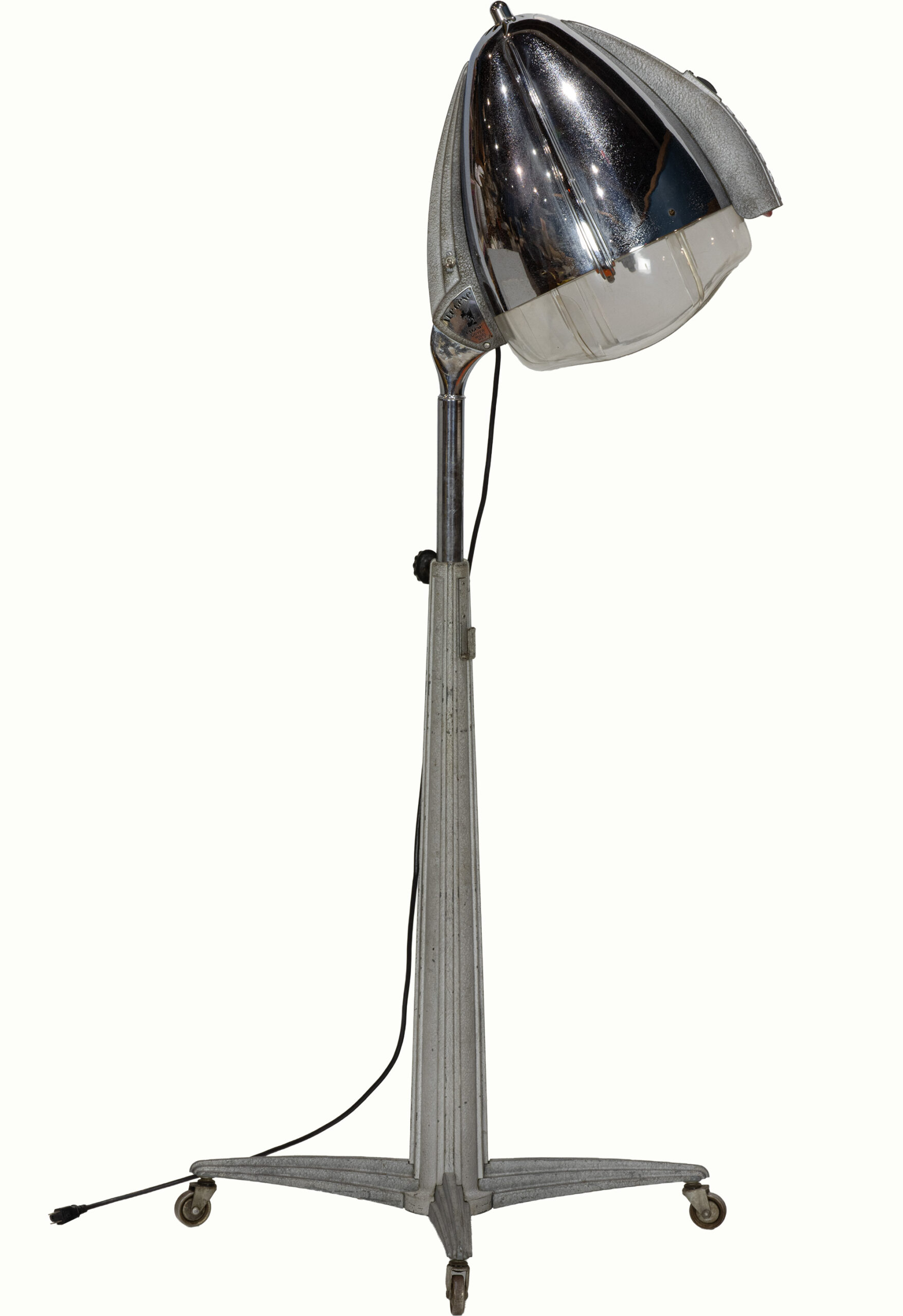 Clayton Bailey (American, 1939–2020), Eugene Hair Dryer Lamp, mixed media floor lamp with lighting, overall: 61.5″h x 20″w at base/12″w at dryer shade.Estimate: $5,000–$7,000