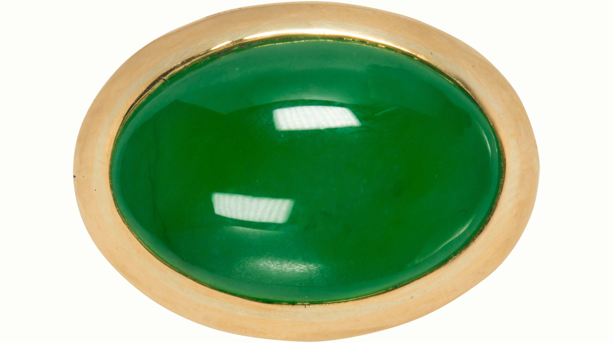 A jadeite and 18k gold ring. Sold: $12,800
