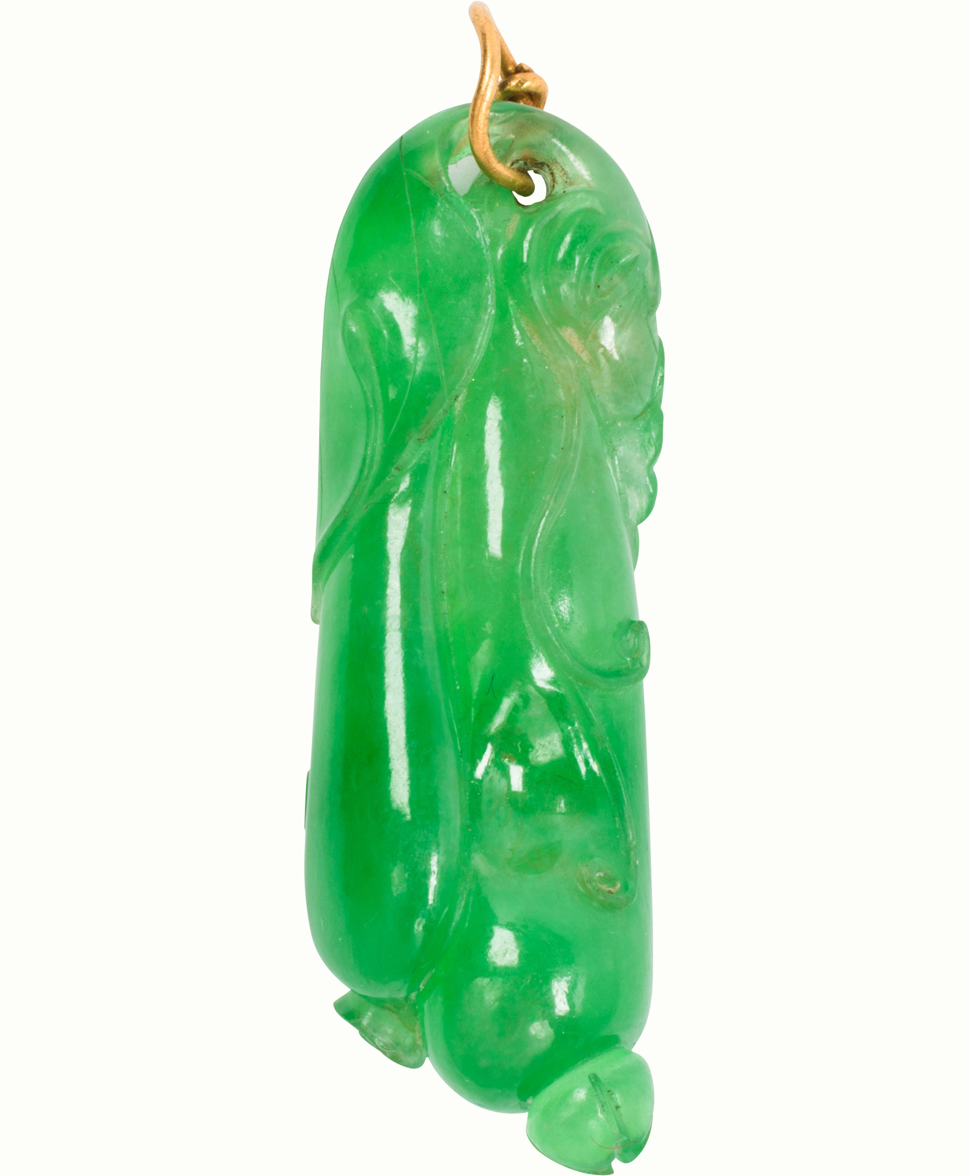 A carved jade and 22k gold pendant. Estimate: $600–$800