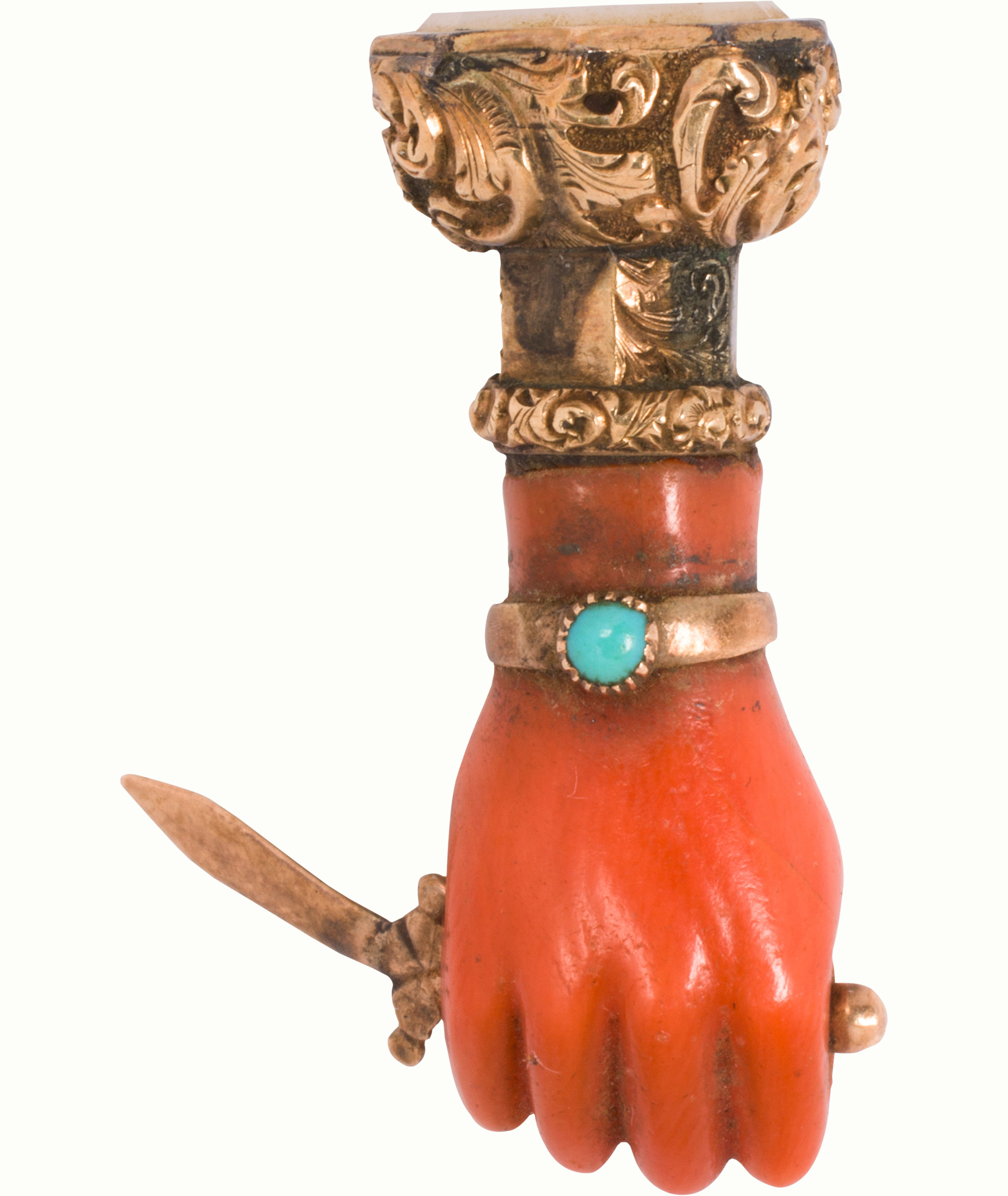 A Victorian coral, turquoise and gold-filled figa seal. Estimate: $300–$500