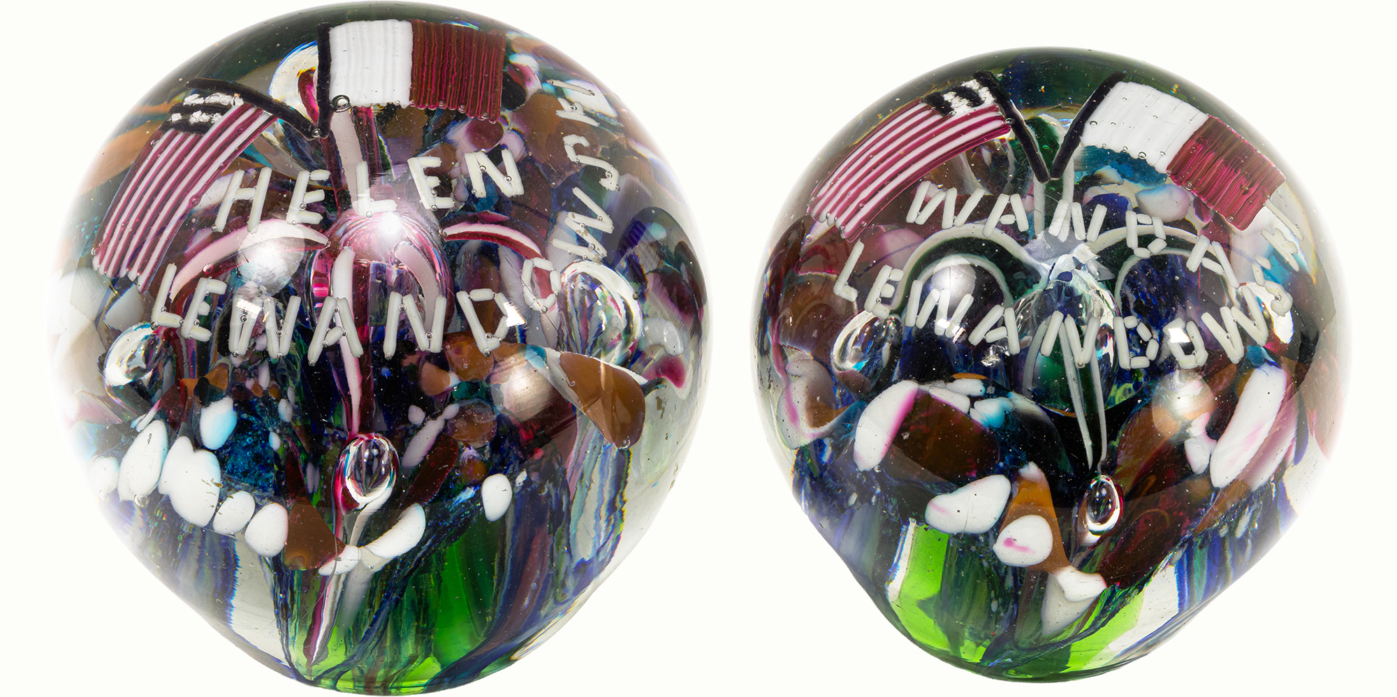 A rare antique pair of dual American and Italian flag glass paperweights. Estimate: $400–$600