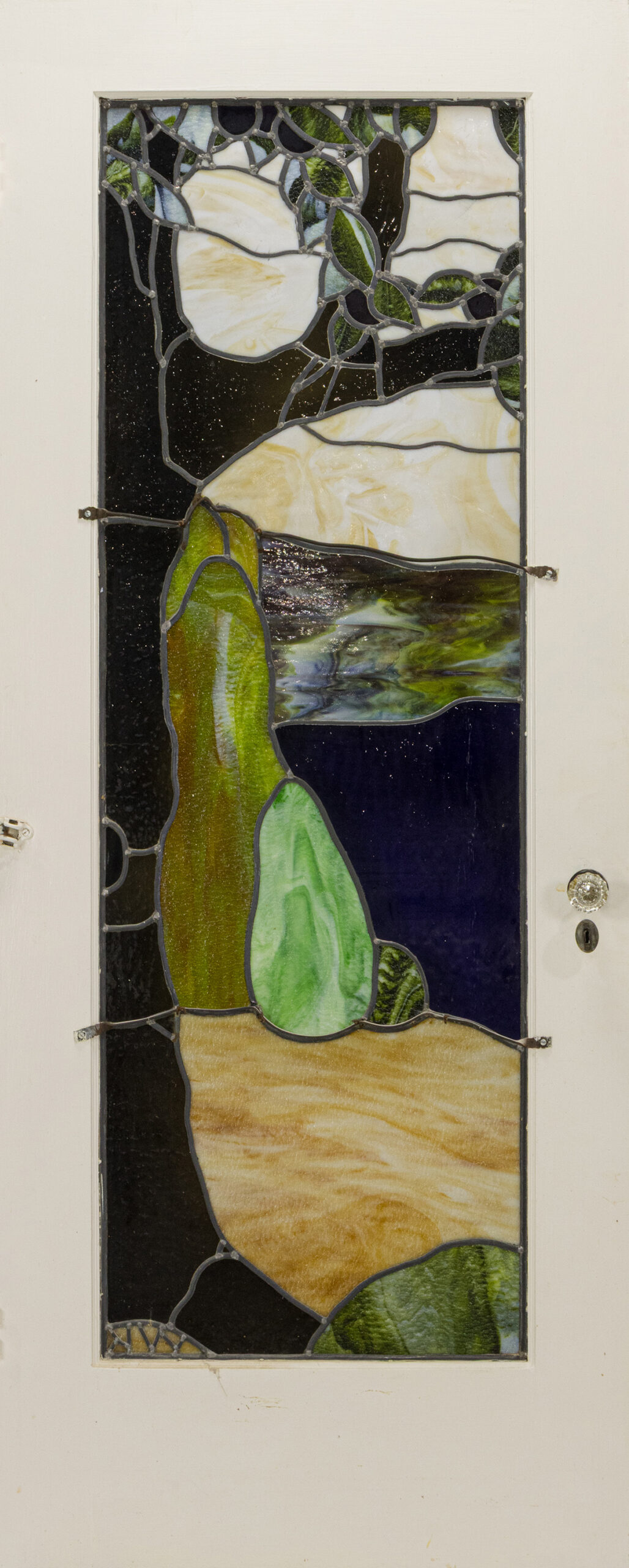 An Arts and Crafts Wilder Bentley leaded glass door, original to the Frederickson House, Berkeley, CA. Estimate: $2,000–$4,000