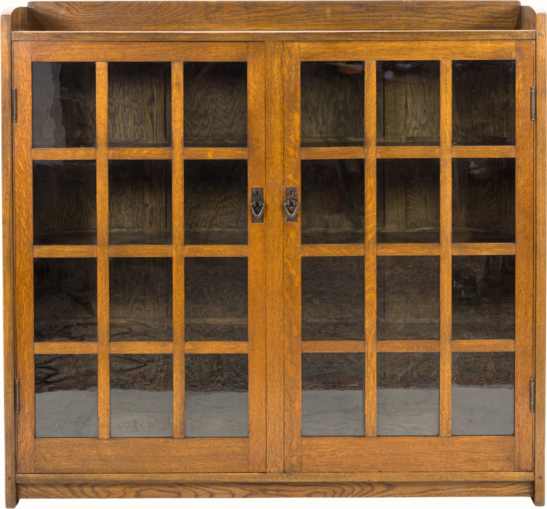 A Gustav Stickley bookcase, Eastwood New York. Estimate: $1,500–$2,500