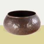 A Dirk van Erp and Elizabeth D&rsquo;Arcy Gaw hammered copper red warty bowl. Sold: $37,800